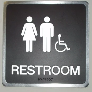 Black and silver Restroom Sign