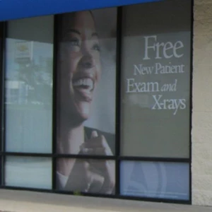 Perforated Window Graphics Installed on Storefront Windows