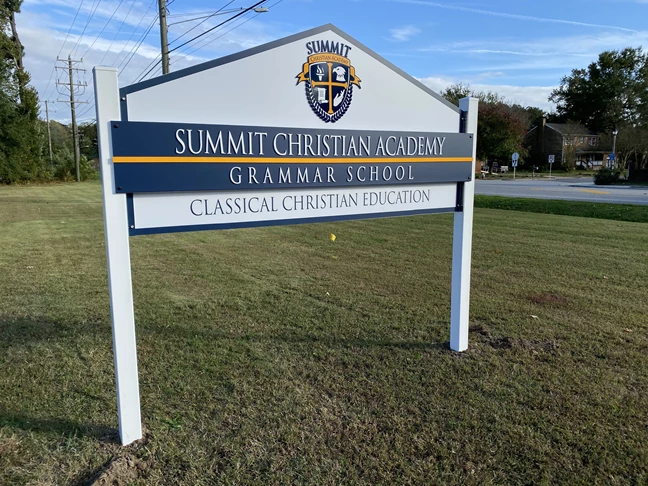 Post and panel sign for christian academy grammar school