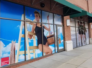 Perforated Window Film Graphic for European Wax Center with lady in swimsuit