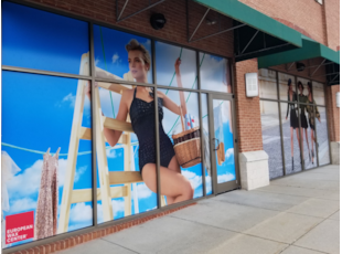 Perforated Window Film Graphic for European Wax Center with lady in swimsuit