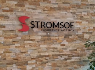 Acrylic Standoff Sign for Insurance Agency on Brick Wall