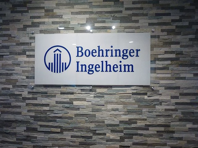 Indoor Lobby Acrylic Sign with Standoffs on Stone Background