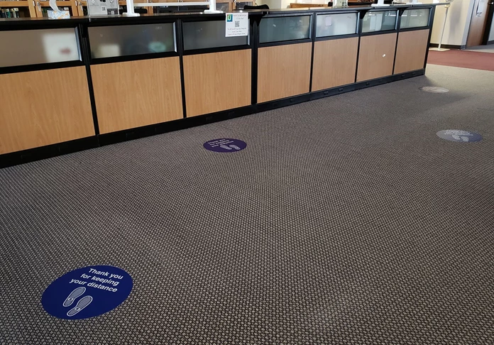 Social DIstancing Floor Graphics in School Reception Area