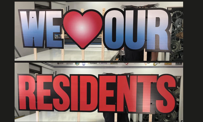 Routed Coroblast Signs for We Love Our Residents