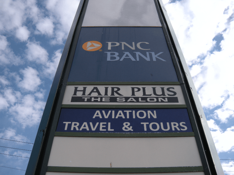 Pylon sign - Aviation Travel and Hair Plus
