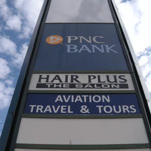 Pylon sign - Aviation Travel and Hair Plus