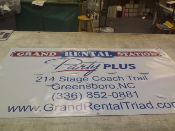 Grand Rental Station Banner with Wind Slits