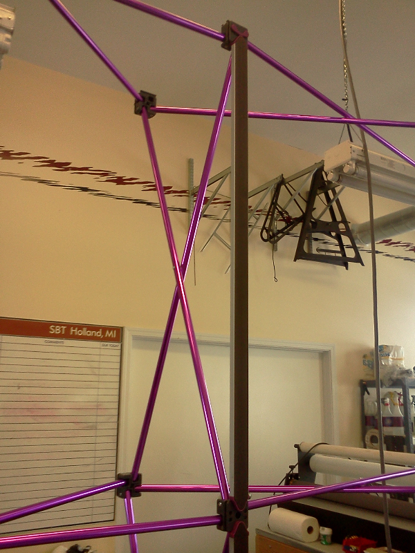 Trade show display frame with magnet strips attached.