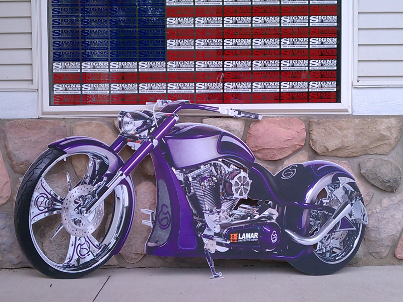 Digitally printed on coroplast and cut out.