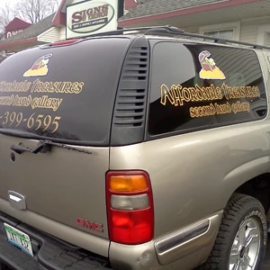 Digital printed vinyl with lamination and cut vinyl on a vehicle.