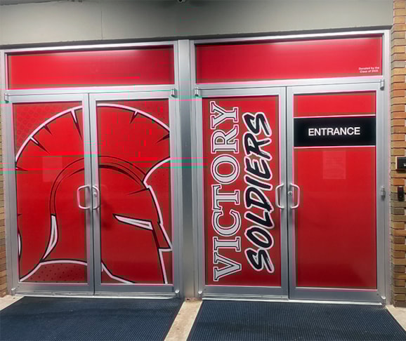 Start the day off right by welcoming students and guests with vibrant entryway graphics on your doors and windows!