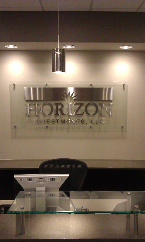 stainless steel cut letters and logo on glass