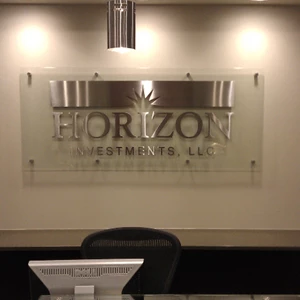stainless steel cut letters and logo on glass