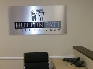 Silver Dibond Lobby Logo with Standoffs for Hutton Patt Title & Escrow