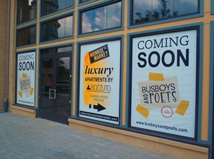 custom window display banners for coming soon under construction space