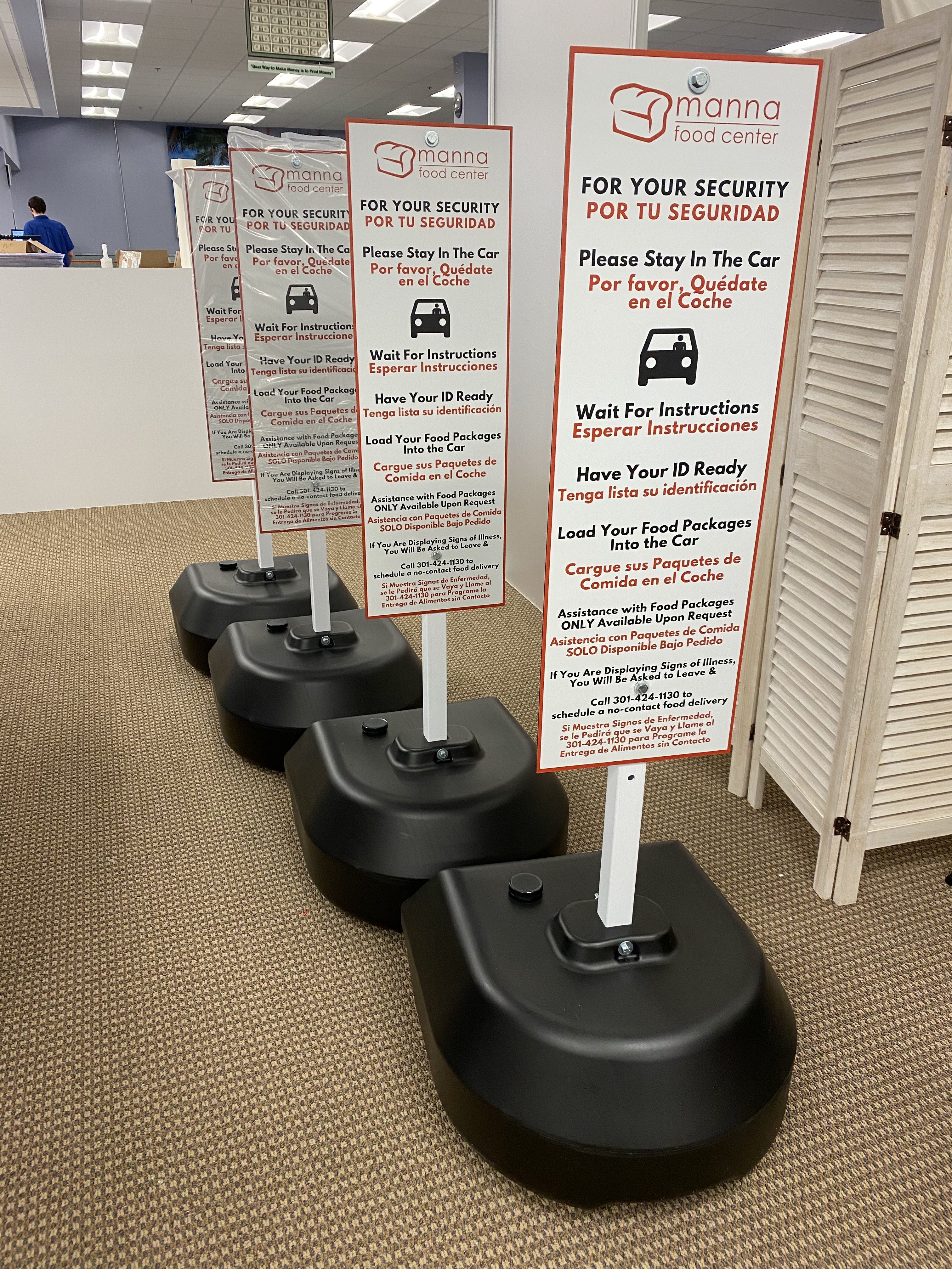 custom printed signs in outdoor weighted stands portable