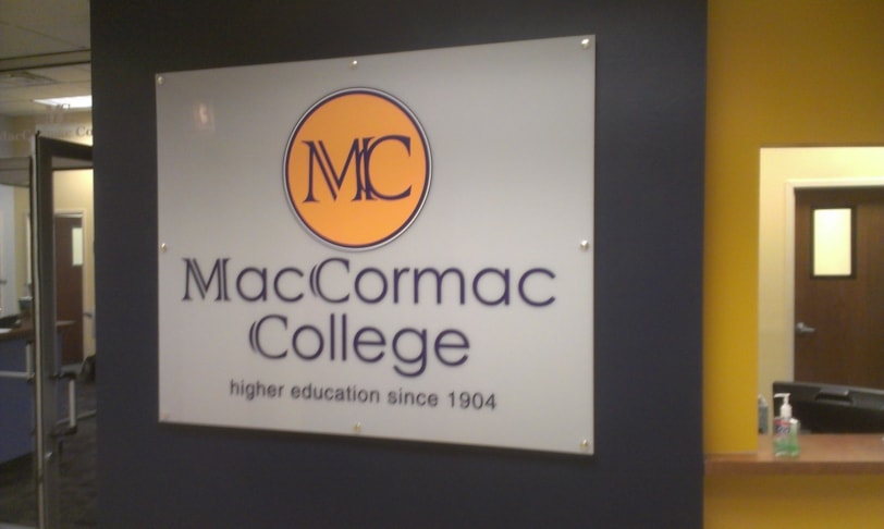 White acrylic with digitally printed vinyl lettering and stand offs