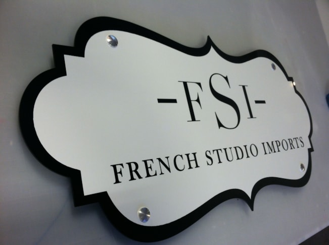 Contour cut black acrylic with white vinyl and stand offs