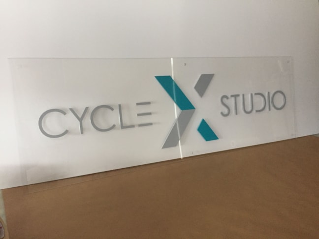 Clear acrylic with 3 dimensional custom painted lettering.