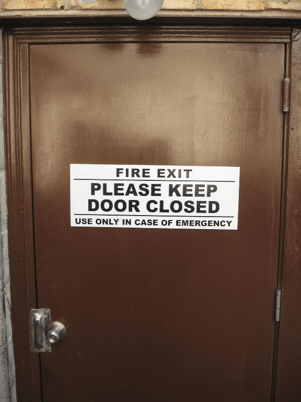 White corrugated double stick taped to door