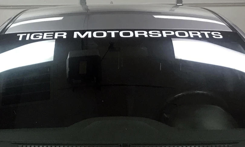 Cut vinyl vehicle lettering on windshield