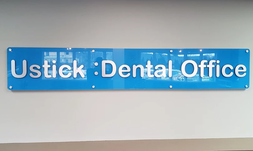 Acrylic dimensional lettering on acrylic back panel lobby sign