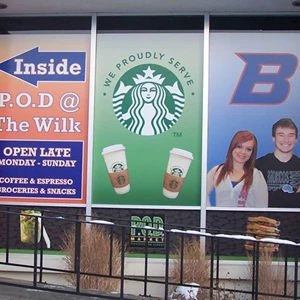 Full color vinyl window graphics promote services and provide directions as well