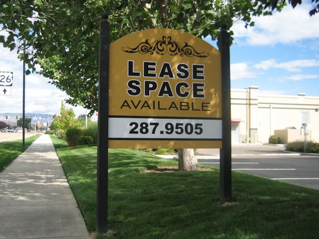 The combination of design, color, and contoured shaping lend elegance to a post and panel sign