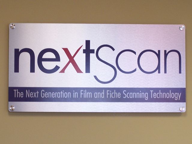 Brushed Aluminum Lobby sign, mounted with standoffs, makes a great statement