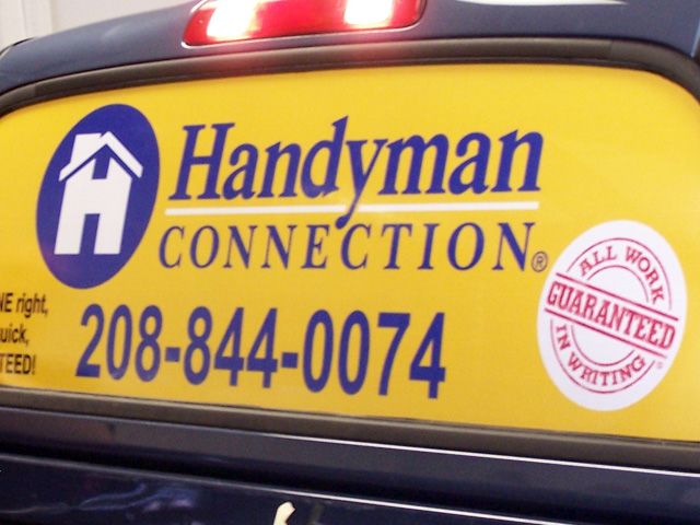 Brightly colored window perf makes a statement against the navy blue vehicle