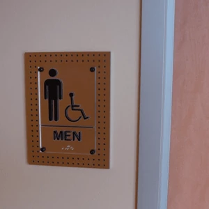 Industrial looking ADA signs for restrooms