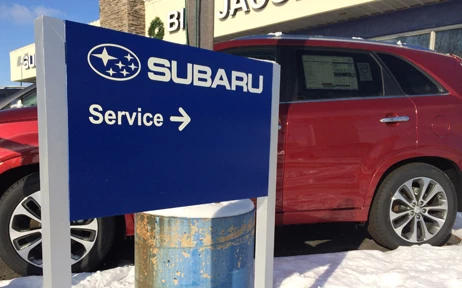 Aluminum post and panel sign with reflective lettering at auto dealer in Joliet
