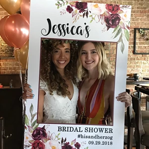 Beautiful ladies in a custom wedding frame for instagram pictures