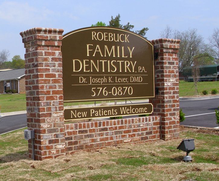Roebuck Family Dentistry: Double sided high density urethane sign mounted between columns