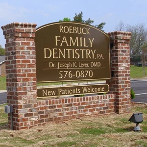 Roebuck Family Dentistry: Double sided high density urethane sign mounted between columns