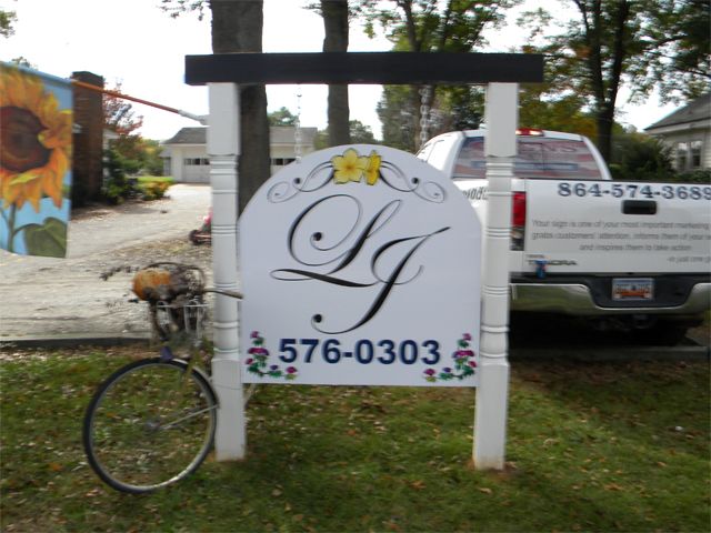 Liza Jane's in Roebuck, replace graphics on existing Post and Panel Sign.
