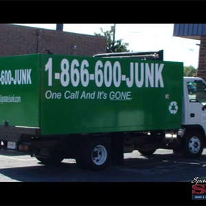 Upstate Junk, White graphics on box truck.