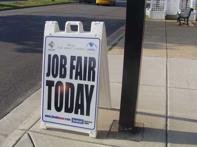 a-frame sign on the sidewalk for a job fair