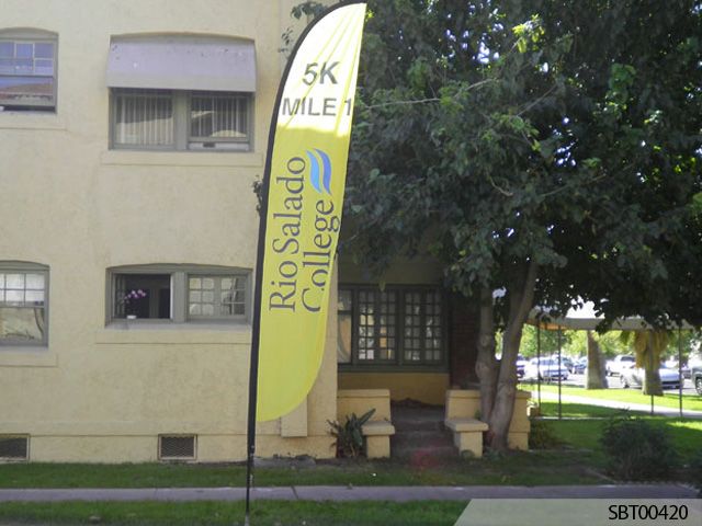 tall feather flag on a college lawn for a 5K run