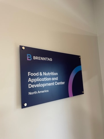 Premium sub-surface printed acrylic display panels utilizing brushed aluminum architectural standoffs for dimensional impact.