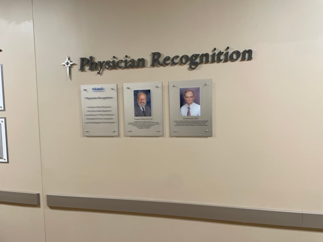 Polished acrylic recognition displays featuring interchangeable graphic fields, ideal for dynamic healthcare and professional environments.