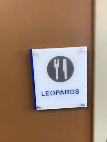 High-durability commercial facility signage combining clean modern design with long-lasting structural materials. Pictogram raised text ADA signs for restrooms with braille