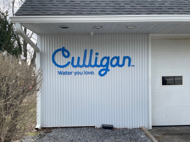 Custom dimensional aluminum logo sign for Culligan Water in Allentown, PA, including permitting drawings and professional exterior sign installation for a clean, branded building presence.
