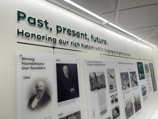 Immersive environmental storytelling combining large-format graphics with multi-layered dimensional display panels.