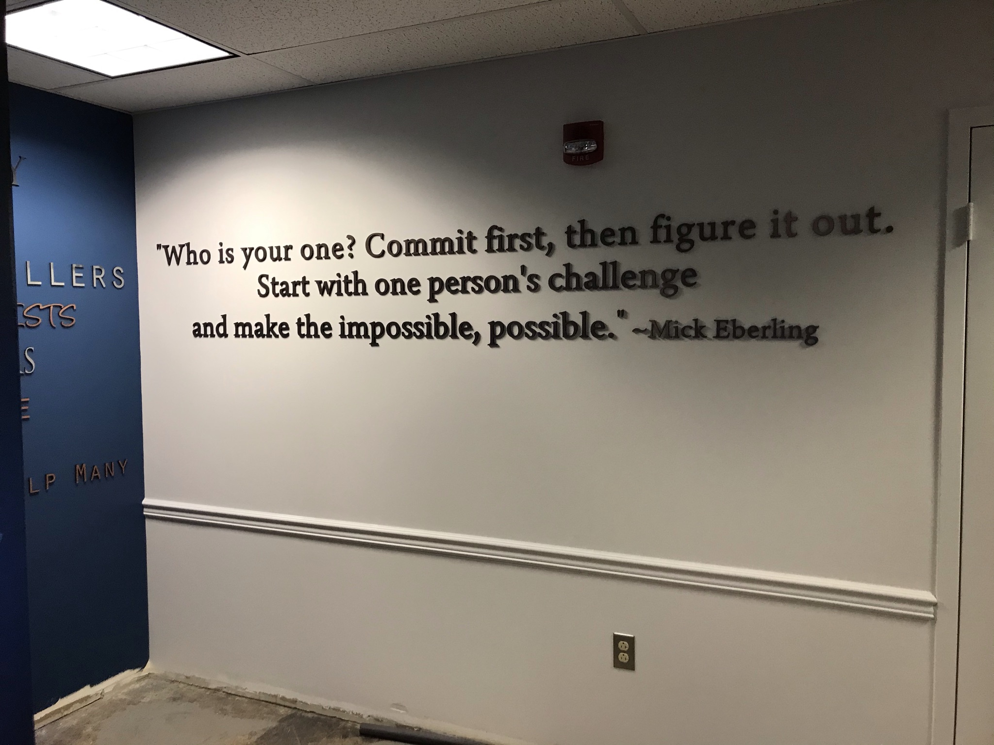 Precision-fabricated dimensional lettering adds depth and visual permanence to a core facility mission statement.