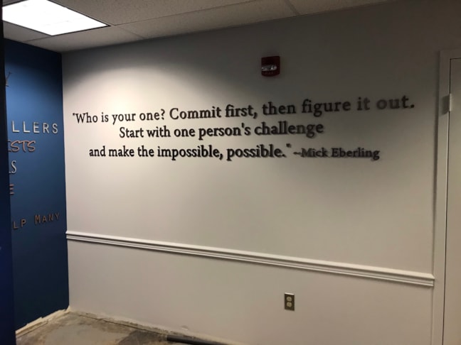 Precision-fabricated dimensional lettering adds depth and visual permanence to a core facility mission statement.