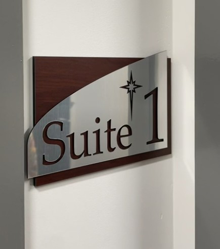 A dimensional side profile showing the layered thickness of our architectural corporate signage, featuring cut-out custom lettering and architectural curves.ADA Signage & Compliance – Allentown Lehigh Valley PA