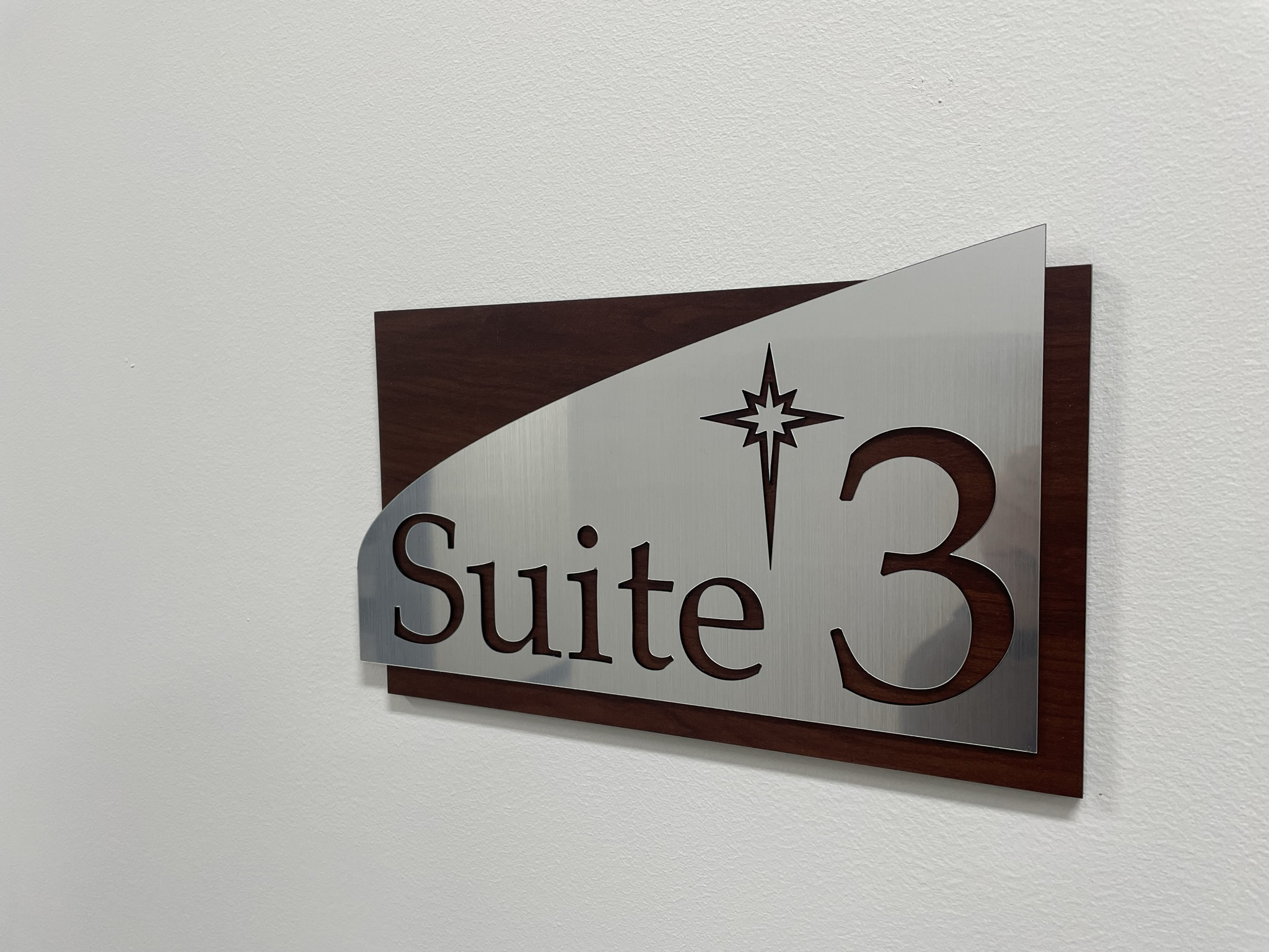 A dimensional side profile showing the layered thickness of our architectural corporate signage, featuring cut-out custom lettering and architectural curves.ADA Signage & Compliance – Allentown Lehigh Valley PA