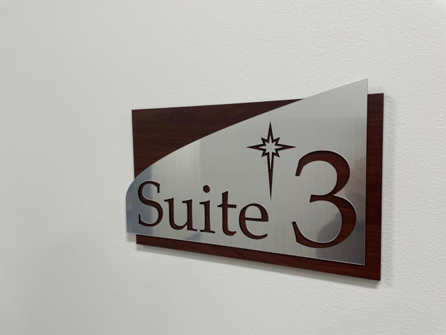 A dimensional side profile showing the layered thickness of our architectural corporate signage, featuring cut-out custom lettering and architectural curves.ADA Signage & Compliance – Allentown Lehigh Valley PA